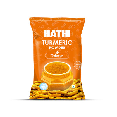 Hathi Rajapuri Turmeric Powder 500g bright orange front pack with cryogenic technology badge, bowl of rich golden turmeric powder and fresh whole Rajapuri turmeric roots